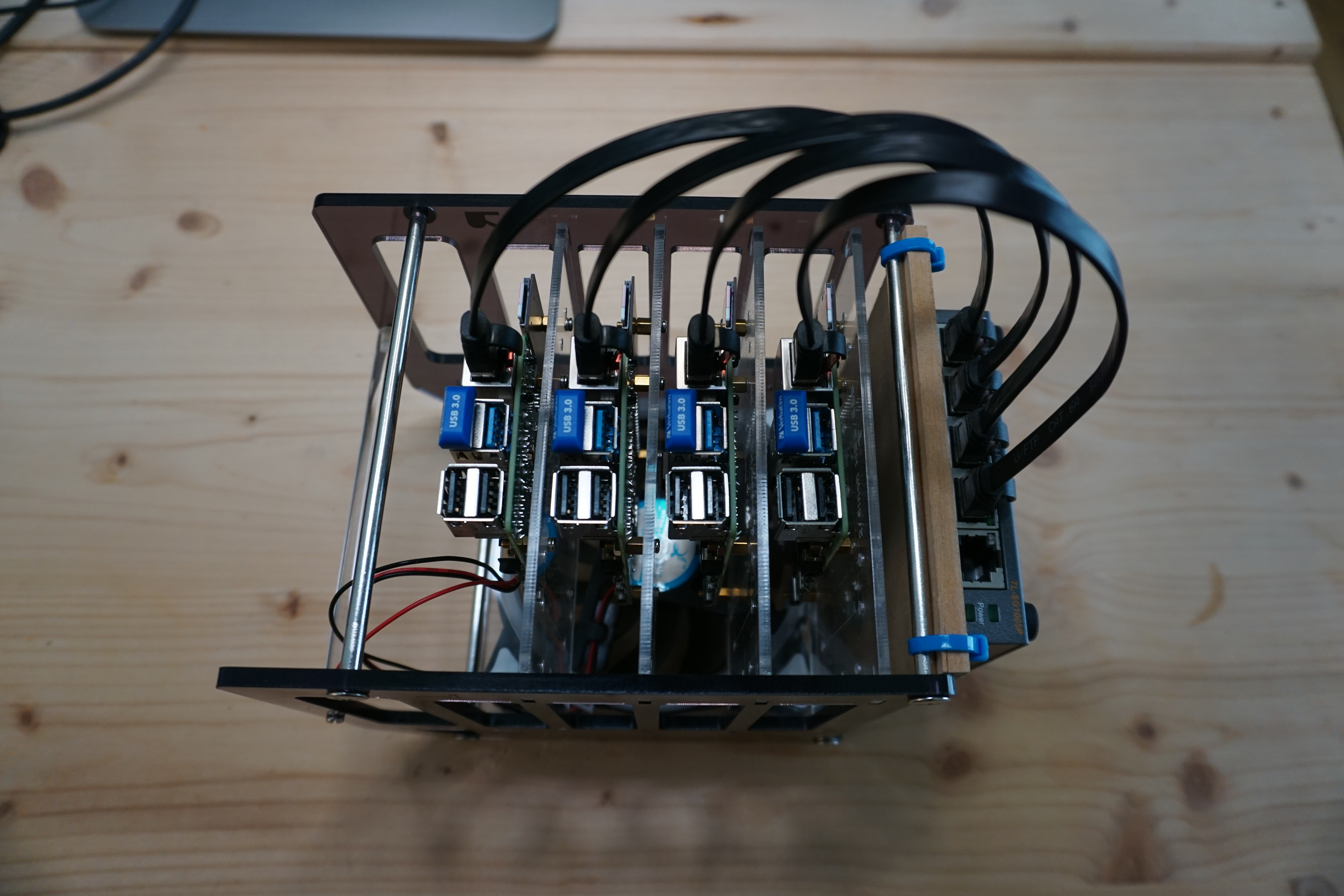 Fully assembled case with switch, cables, USB sticks and the raspberries